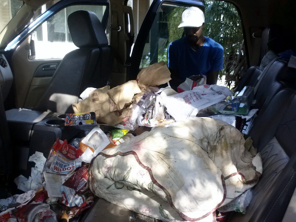 Cleaning Car Interior Trash Before Detaining In Clearwater